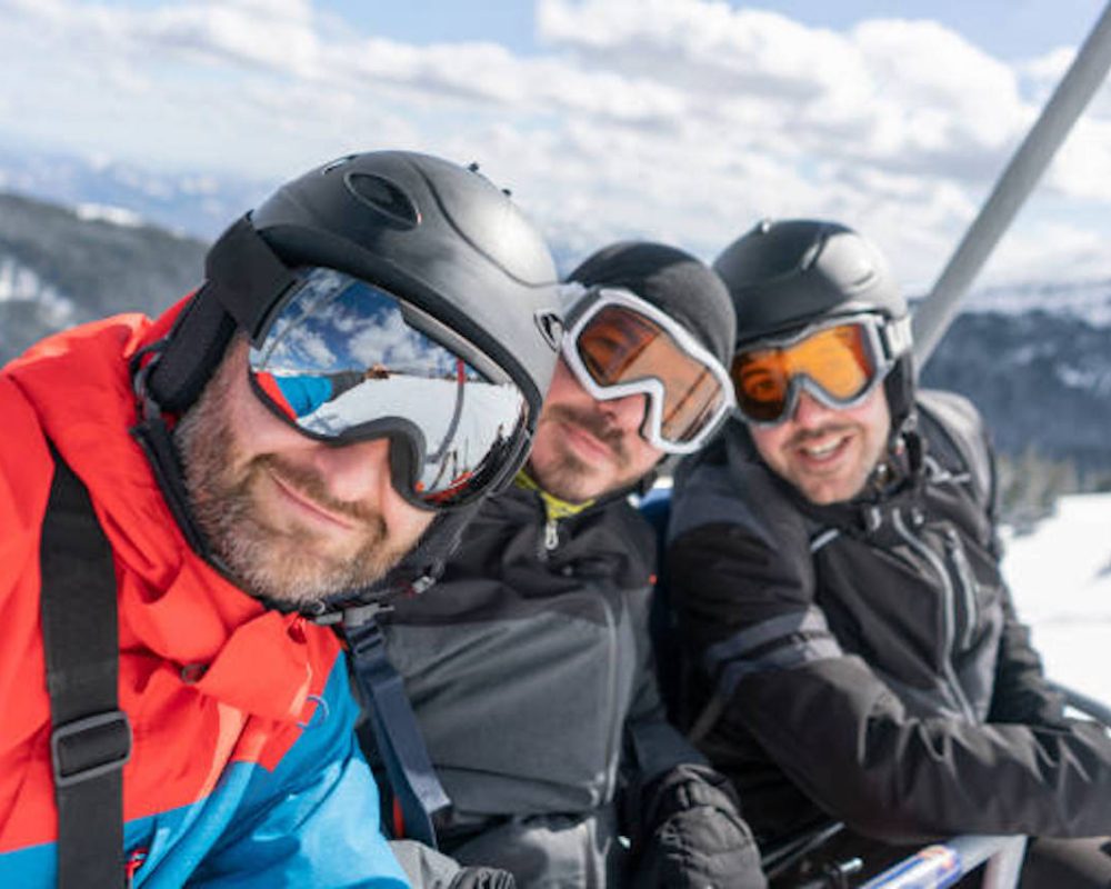 Selfie of the three skiers at the ski lift.